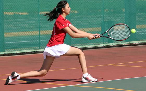 Kinnick's Ivory Ho hits a backhand during Saturday's Kanto Plain tennis matches. Ho and her partner Cecelia Bonadie lost their doubles match to Seisen's Jiwoo Hong and Aoba Shimada  8-3.