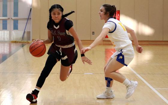 Perry's Elieza Cuaco dribbles against Yokota's Lucero Giddens.