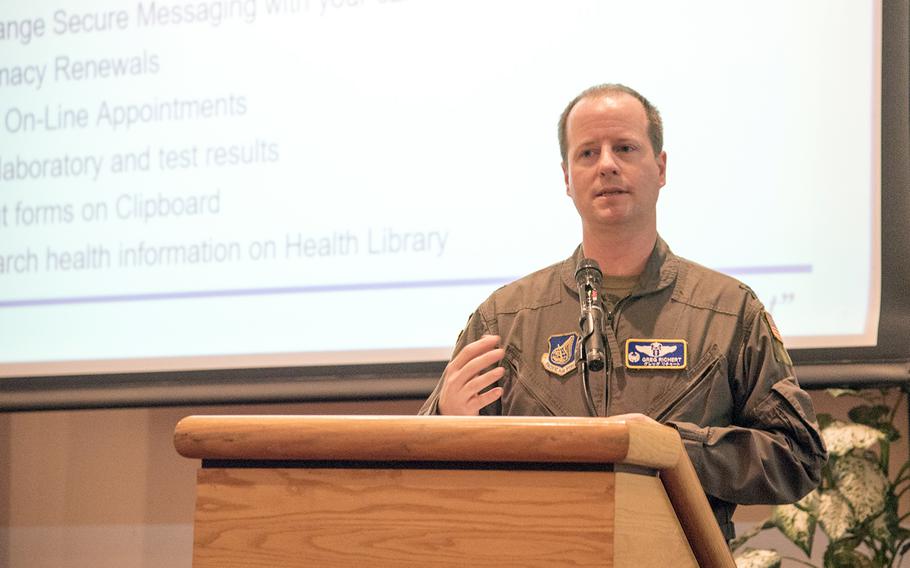 Dr. Gregory Richert, an Air Force colonel who serves as commander of the 374th Medical Group and command surgeon for 5th Air Force and U.S. Forces Japan, explains the Military Health System Genesis system during a town hall meeting at Yokota Air Base, Japan, Thursday, Aug. 31, 2023. 