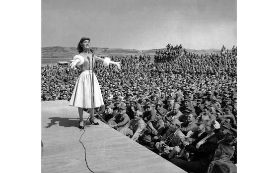 Seoul, South Korea, May 23, 1955: Singer and actress Debbie Reynolds performs before some 5,000 U.S. Army Korea soldiers who jammed the baseball field at the Seoul Military Post. Miss Reynolds was one of the acts of the "Johnny Grant Galaxy" show. Disc jockey Johhny Grant and his troup's week-long tour includes stops in both South Korea as well as Japan.

Looking for Stars and Stripes’ historic coverage? Subscribe to Stars and Stripes’ historic newspaper archive! We have digitized our 1948-1999 European and Pacific editions, as well as several of our WWII editions and made them available online through https://starsandstripes.newspaperarchive.com/

META TAGS: Pacific; Korea; actor; celebrity; entertainment; musician; singer; performance; servicemembers; Army; soldiers; Chuck Taylor; audience