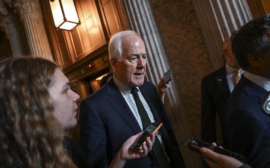 Sen. John Cornyn (R-Tex.) talks to reporters following a procedural vote this month.