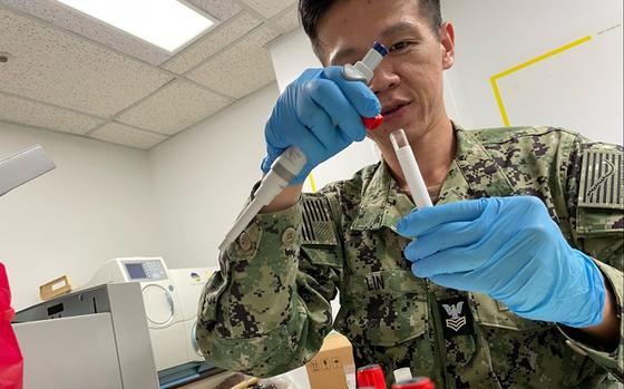 A hospital corpsman processes biological samples during a U.S. Naval Medical Research Unit Indo Pacific study on natural- and vaccine-derived immunity of respiratory diseases in U.S. sailors and Marines in September 2023.