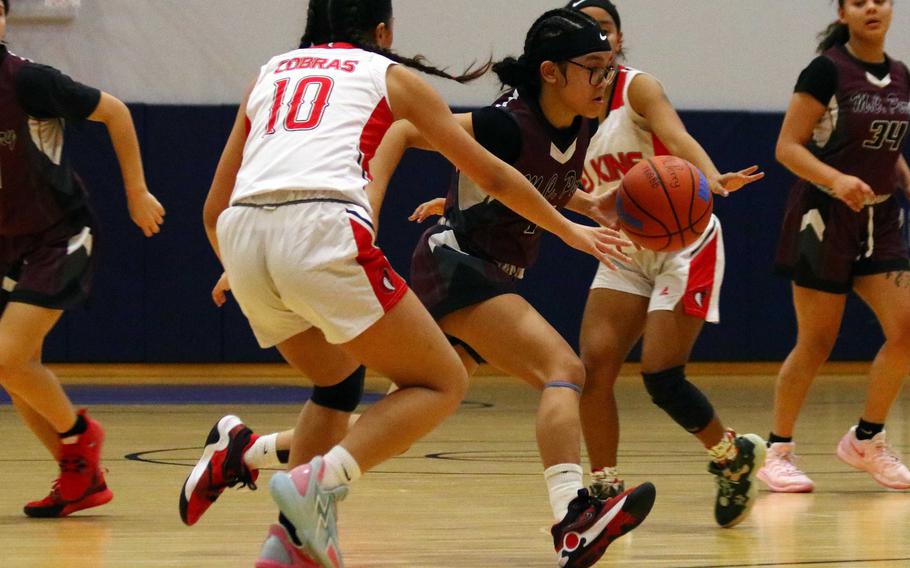 Eliez Mae Cuaco dribbles between foes.