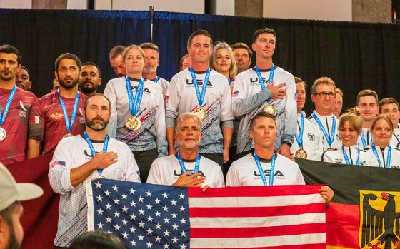 Team USA 8-way receives their gold medal after winning the 8-way Formation Skydiving category of the FAI World Championships ceremony on 11 October 2024.  Sgt. 1st Class Jeshua Stahler, Sgt. 1st Class Michael Connors, and Sgt. 1st Class Mitch Stockenberg, Soldiers from the U.S. Army Parachute Team, were part of the champion team. The ceremony followed a week of competition parachute jumps in Beaufort, N.C. (U.S. Army photo by Megan Hackett)