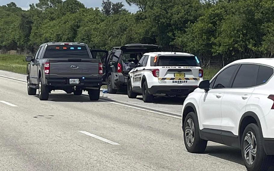 Sheriff’s vehicles surround an SUV on I-95