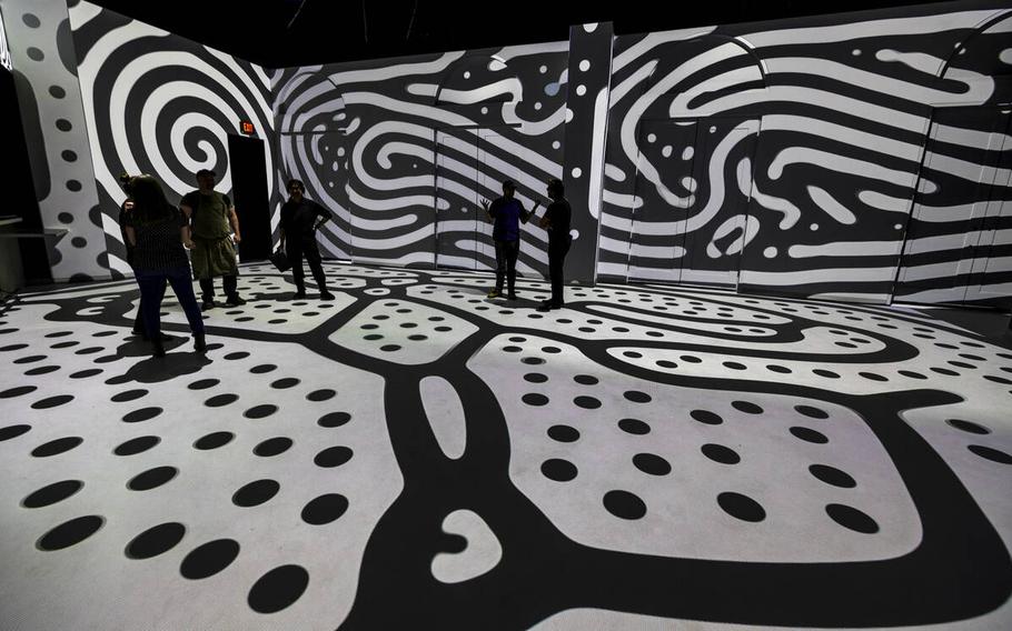 Projections of black and white lines and dots cover the floor and walls at Electric Playhouse, a new high-tech social gaming place opening soon at The Forum Shops at Caesars on June 14, 2024, in Las Vegas. 