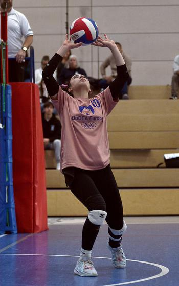 Stuttgart senior Mia Snyder of the Pink team sets the ball during the 2024 DODEA-Europe All-Star volleyball matches on Nov. 9, 2024, at Ramstein High School on Ramstein Air Base, Germany.