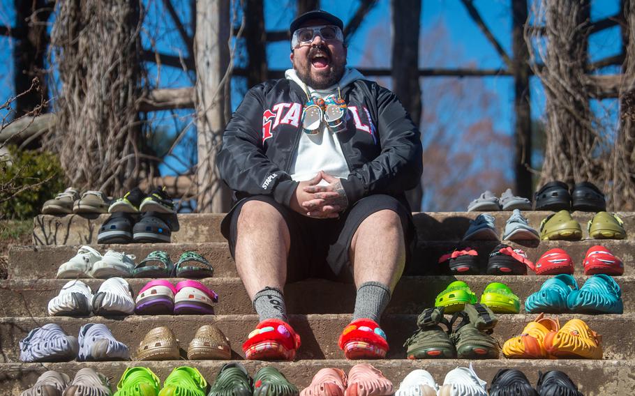 Doogie Sandtiger of West Hartford, Conn., shows a small sample of the 2,077 pairs of Crocs he owns at Elizabeth Park in Hartford, Conn., on March 20. 