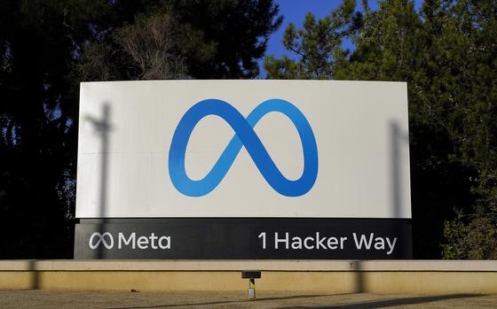 FILE - Meta's logo can be seen on a sign at the company's headquarters ...