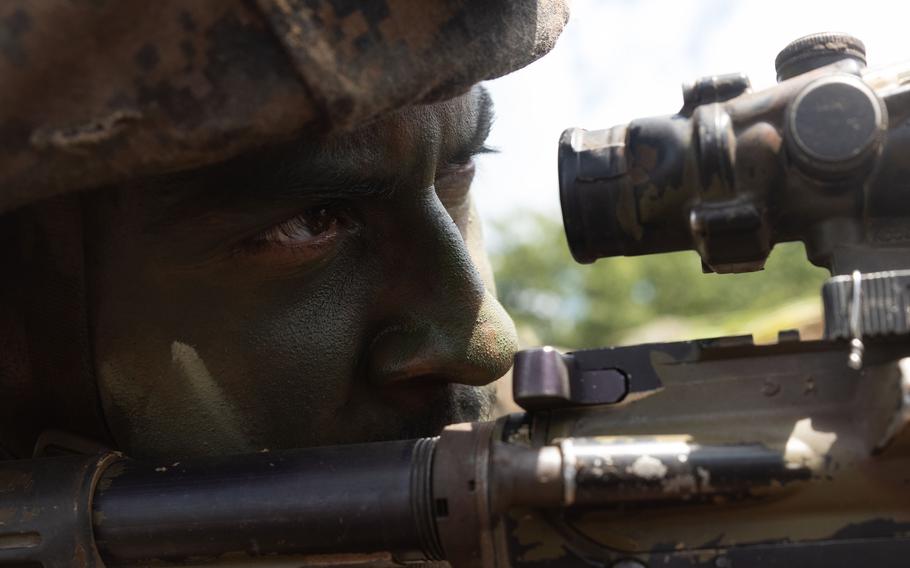 An American service member aims an M4 carbine during Resolute Dragon training in Otia prefecture, Japan, Aug. 1, 2024. 