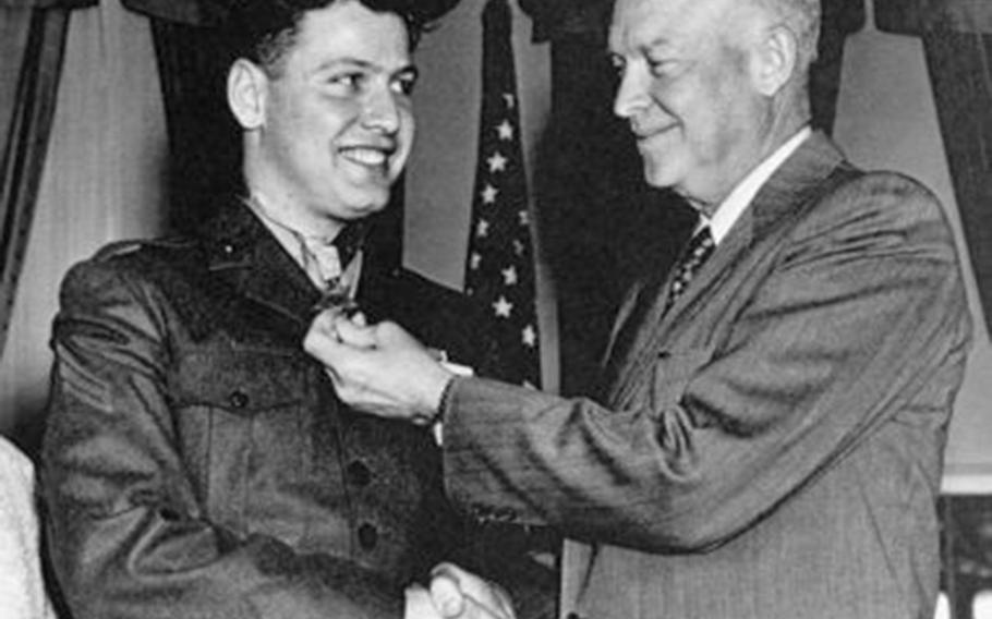 Marine Cpl. Duane Dewey receives the Medal of Honor from President Dwight Eisenhower at the White House, March 12, 1953. 