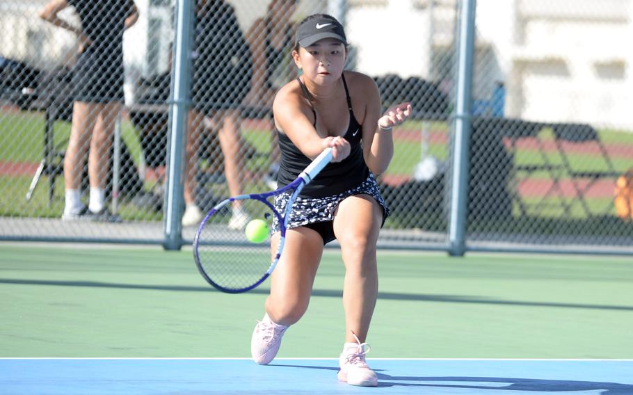 Chloe Lee returns the ball in tennis.