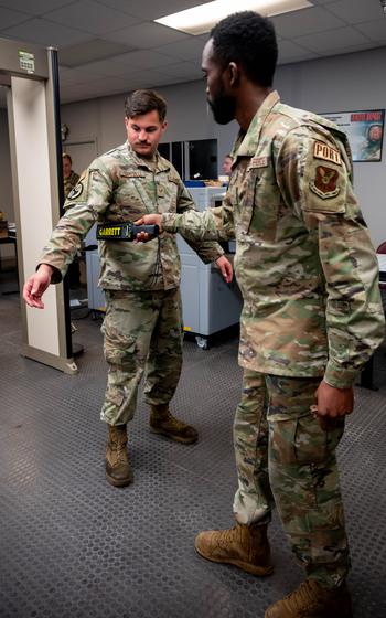 A 5th Logistics Readiness Squadron air transportation specialist uses a metal detector while processing passengers in support of exercise Agile Warbird at Minot Air Force Base, N.D., June 13, 2024. Air transportation specialists are responsible for securely managing cargo and passengers, and ensuring that everything and everyone on a military aircraft is transported safely and quickly. 