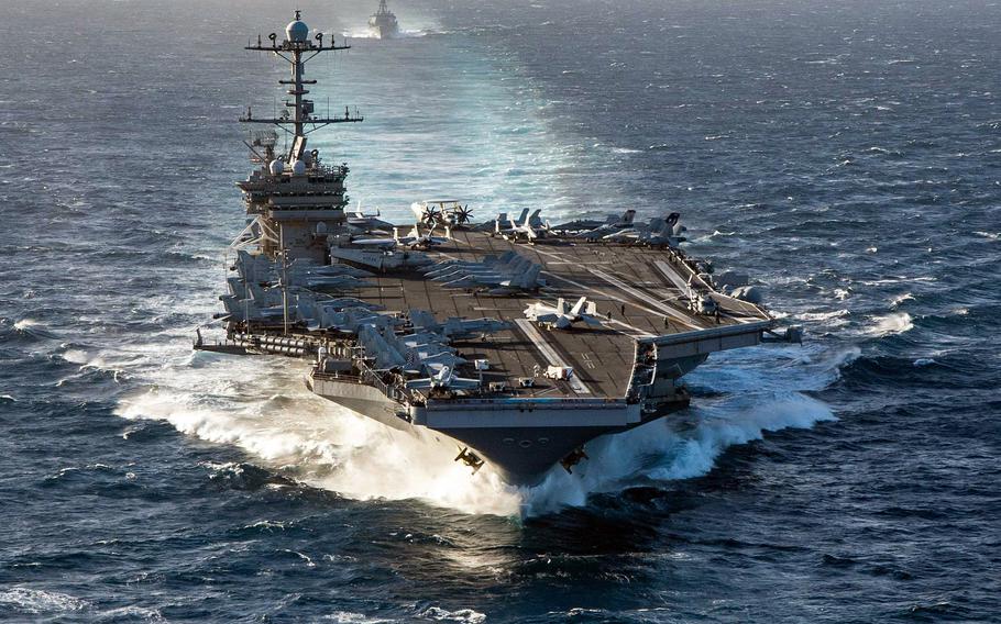 The aircraft carrier USS Harry S. Truman transits the Strait of Gibraltar on Dec. 14, 2021. It is being joined on its deployment in the U.S. 6th Fleet’s area of operations by the Norwegian warship Fridtjof Nansen.