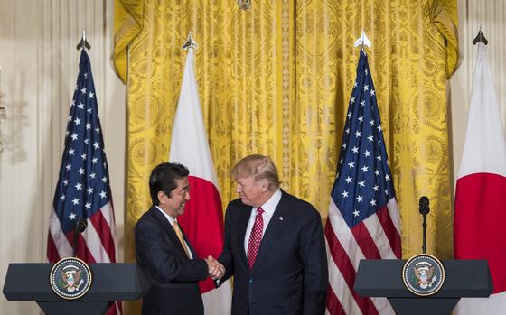 President Donald Trump and Japanese Prime Minister Shinzo Abe shake hands during a joint news conference at the White House on Feb. 10, 2017. MUST CREDIT: Jabin Botsford/The Washington Post