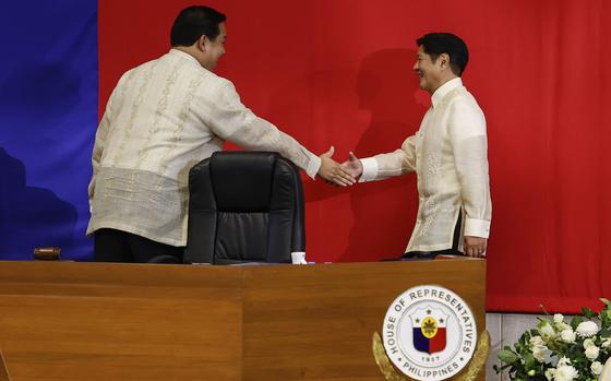 Philippines President Ferdinand Marcos Jr. right, shakes hands with House Speaker Martin Romualdez ahead of the State of the Nation Address at the House of Representatives in Quezon City, Philippines, on Monday, July 22, 2024. 