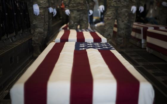 U.S. service members assigned to the Defense POW/MIA Accounting Agency stand by before a solemn movement ceremony at Joint Base Pearl Harbor-Hickam, Hawaii, in January 2018. The ceremony honored personnel lost in the Philippines during World War II.