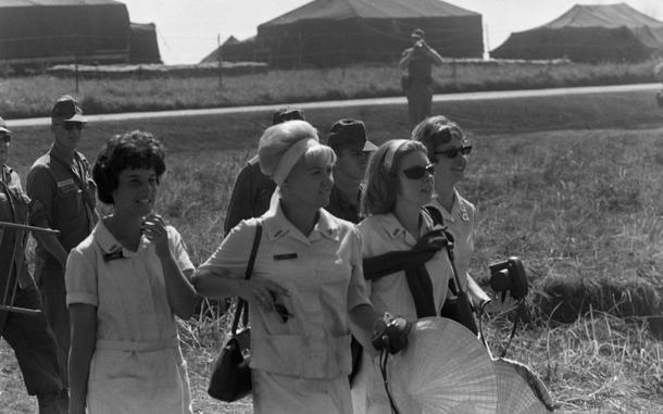 Red Cross Workers - also known as "Donut Dollies" arrive at Bob Hope Show at  the 4th Infantry Divisions HQ in Pleiku, South Vietnam, Dec. 20, 1966. Although the Vietnam Donut Dollies served no donuts, the nickname given to them during the Korean War stuck. 