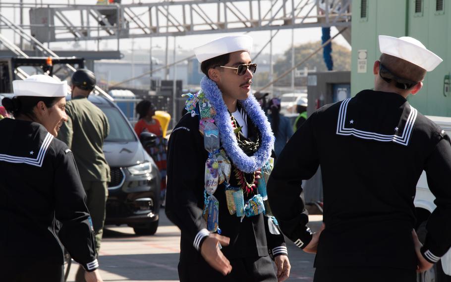 Two sailors greet each other