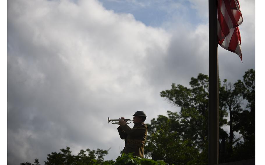 Dressed in a WWI uniform, Chris Gekker plays taps at the World War I Memorial in Washington, D.C. on Monday, May 27, 2024.