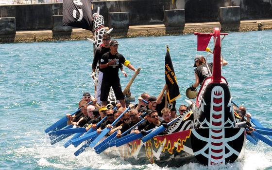 HED: Naha Hari dragon boat race, 2010

Naha, Okinawa, May 5, 2010: The Torii Knights race to the halfway point buoy where they would turn around and race back to the finish line during the annual Naha Hari dragon boat races at Naha, Okinawa. The Knights would go on to win the heat in a time of 5 minutes and 53 seconds. Multiple military teams competed against Japanese teams from all over Okinawa.

Read the article and check out who won here.
https://www.stripes.com/news/2010-05-07/dragon-boats-race-for-bragging-rights-1901718.html1

META TAGS: U.S. Army; U.S. Air Force; U.S. Marine Corps; Tomari Port; sports; Japanese culture; U.S. Navy; Torrii Knights
