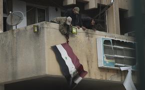 A man drops a flag.