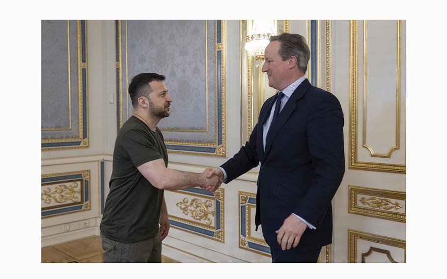 In this photo provided by the Ukrainian Presidential Press Office, Ukrainian President Volodymyr Zelenskyy, left, shakes hands with Britain’s Foreign Secretary David Cameron in Kyiv, Ukraine, Thursday, May 2, 2024. 