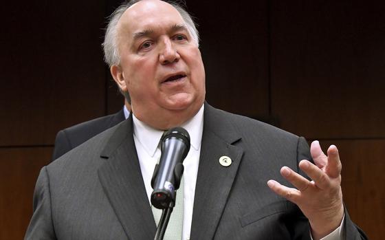 FILE - Former Michigan Gov. John Engler speaks at a news conference on Jan. 31, 2018, in East Lansing, Mich. (Dale G.Young/Detroit News via AP, File)