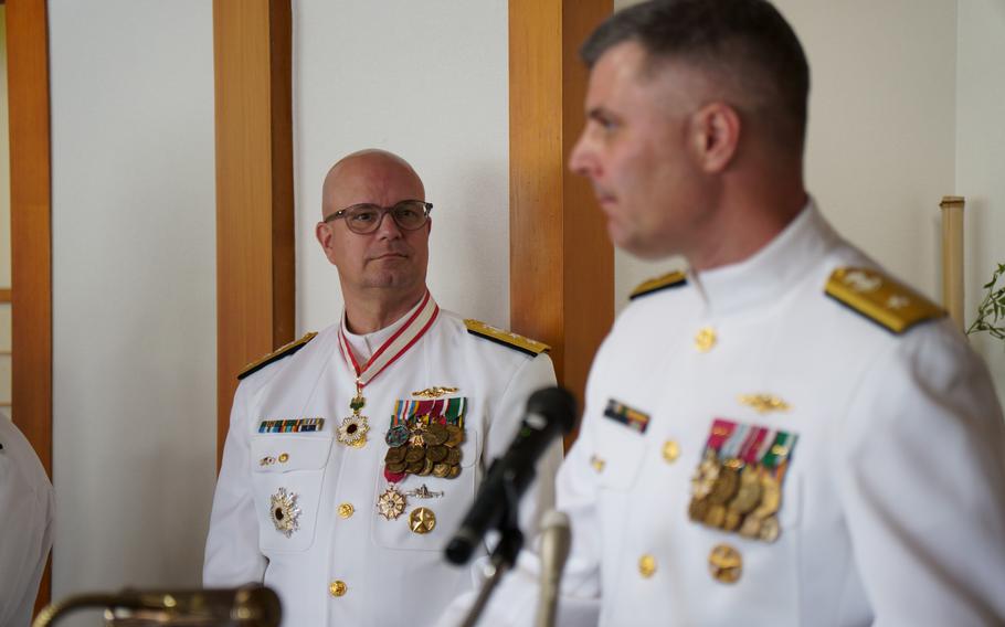 Rear Adm. Ian Johnson, right, answers questions from the media next to his predecessor, Rear Adm. Carl Lahti, after a change of command ceremony at Yokosuka Naval Base, Japan, June 26, 2024.