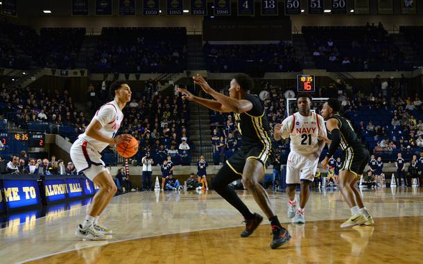 ANNAPOLIS, Md. (Feb. 15, 2025) U.S. Naval Academy Midshipmen men's basketball junior forward Donovan Draper squares off against a defender during Navy’s game against the U.S. Military Academy Black Knights at Alumni Hall on the campus of the Naval Academy in Annapolis, Maryland. The men's team defeated Army 54-61 in the second game of a doubleheader, while the women fell to Army 68-64. (U.S. Navy photo by Mass Communication Specialist 2nd Class Jacob D. Moore)