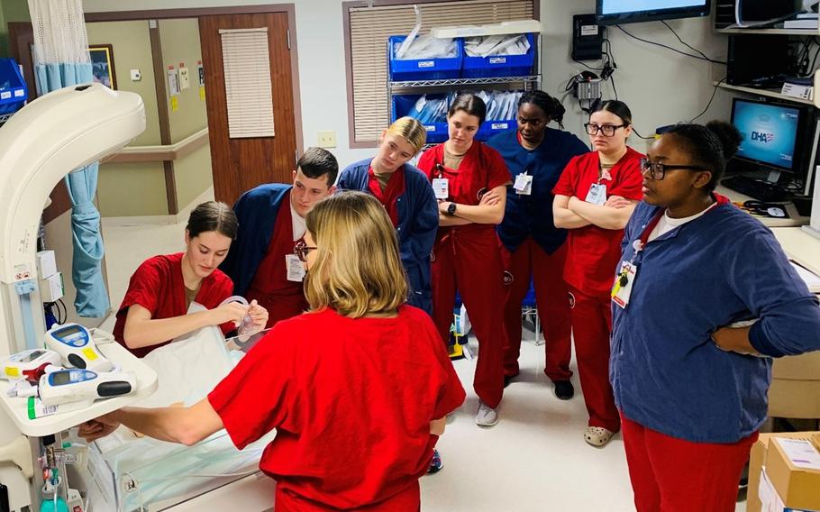 Lt. Christina Acosta demonstrates newborn resuscitation procedures at the U.S. Naval Hospital Rota in Spain.