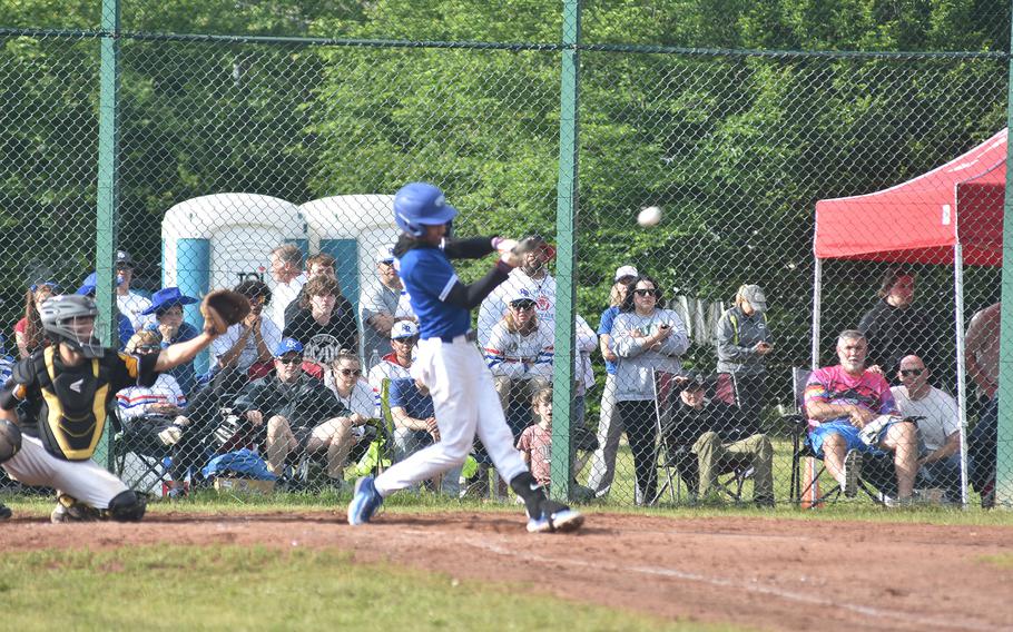 Ramstein's Christian Roy drills a single to center field Friday, May 24, 2024 at the DODEA European Division I baseball championship game at Ramstein Air Base, Germany.
