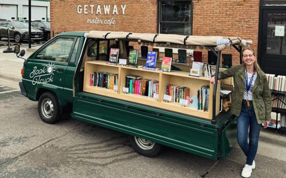 Rachel Cleveland opens her Little Charity Book Truck for sales. The nonprofit mobile bookstore drives around the Twin Cities area selling books and donating 40% of proceeds to charity.  