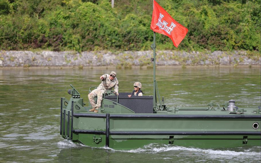 Sgt. Daniel Beltran gives directions from his M30 Bridge Erection Boat during a field exercise 