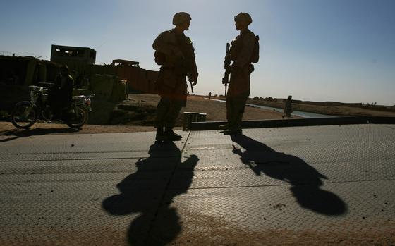 Forward Operating Base Hanson, Afghanistan, Oct. 17, 2012: First Lt. James Mauch, left, and Corpsman Christopher Coughlin, both of 3rd Battalion, 8th Marine Regiment, pause Oct. 17 while working in Marjah district, Helmand province, Afghanistan. 

META TAGS: Operation Enduring Freedom; U.S. Marine Corps; USMC; Marines; Helmand; War in Afghanistan; Wars on Terror