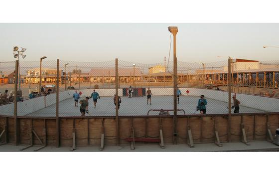 Kandahar, Afghanistan, Nov. 8, 2010: Players scrimmage in preparation for the upcoming season of the Kandahar Hockey League at Kandahar Air Field in southern Afghanistan. Last season, there were 24 teams in the ball hockey league -- 21 made up of Canadians, two from Slovakia and one from the United States. 

Read the article and check out additional photos here.
https://www.stripes.com/theaters/middle_east/ball-hockey-league-flourishes-in-afghanistan-on-kandahar-s-rink-1.125126

META TAGS: Afghanistan; Wars on Terror; Operation Enduring Freedom; military life; downrange life; 