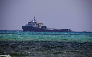 The Atlantic Power, a 250-foot anchor handling ship, floats idle off Government Cut in Miami Beach Tuesday, Oct. 22, 2024, after Miami-Dade Fire Rescue hoisted its captain from the vessel and took him to Ryder Trauma Center at Jackson Memorial Hospital.