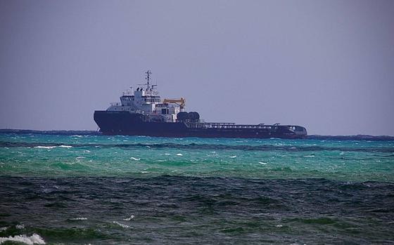 The Atlantic Power, a 250-foot anchor handling ship, floats idle off Government Cut in Miami Beach Tuesday, Oct. 22, 2024, after Miami-Dade Fire Rescue hoisted its captain from the vessel and took him to Ryder Trauma Center at Jackson Memorial Hospital.