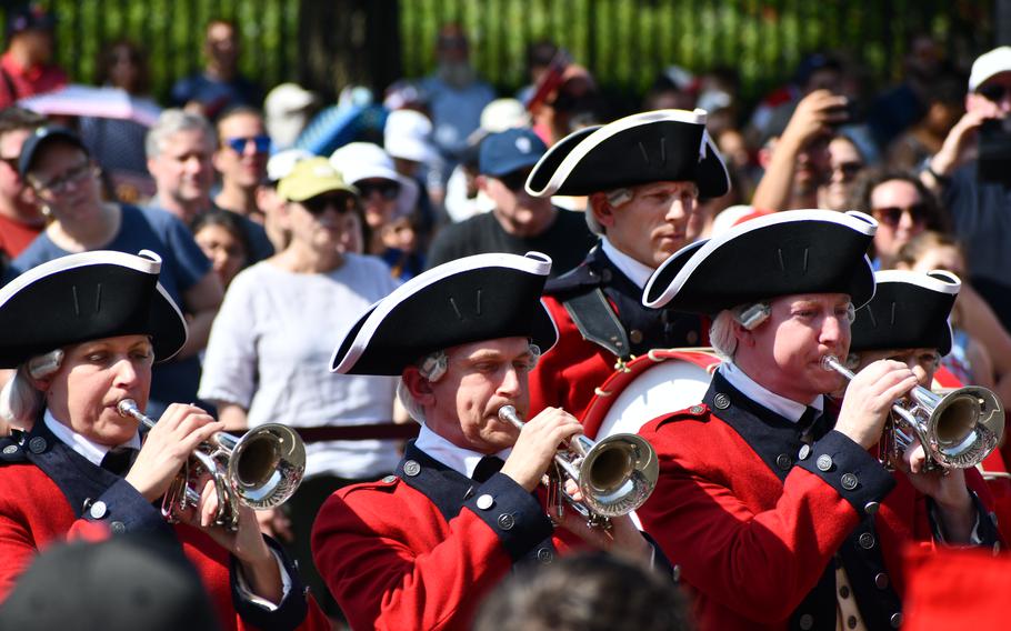 Members of the 3rd U.S. Infantry Regiment, Old Guard, Fife and Drum Corps blow trumpets at the National Archives’ July 4th event in Washington, DC.