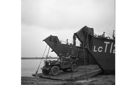 Hed: Exercise Jupiter, 1951

Dornheim, Germany, Sep. 29, 1951: A jeep emerges from a LTC 1283 landing craft after having crossed the Rhine river during Operation Jupiter. The three-day French directed war games had some 150,000 Allied troops - including 45,000 Americans of the Army's V Corps - enact a mass counterassault across the Rhine against "enemy" troops dug in on the east bank.

Looking for Stars and Stripes’ historic coverage? Subscribe to Stars and Stripes’ historic newspaper archive! We have digitized our 1948-1999 European and Pacific editions, as well as several of our WWII editions and made them available online through https://starsandstripes.newspaperarchive.com/

META TAGS:  U.S. Army; SHAPE; Supreme Headquarters Allied Powers; exercise; soldier; dual exercise; Allied Forces; Ike; French army; village; NATO; amphibious