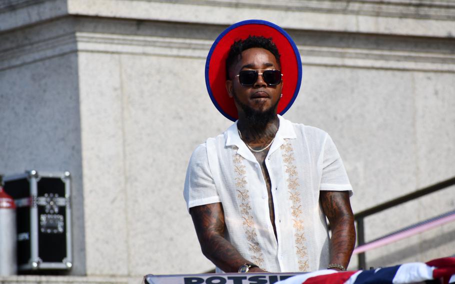 A member of The Experience Band and Show plays the keyboard on the steps of the National Archives on July 4, 2024.