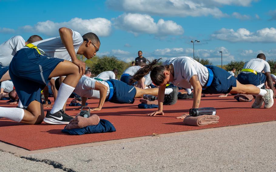 Trainee Anita Alvarez, 331st Training Squadron, completes the push up portion of her official physical fitness test