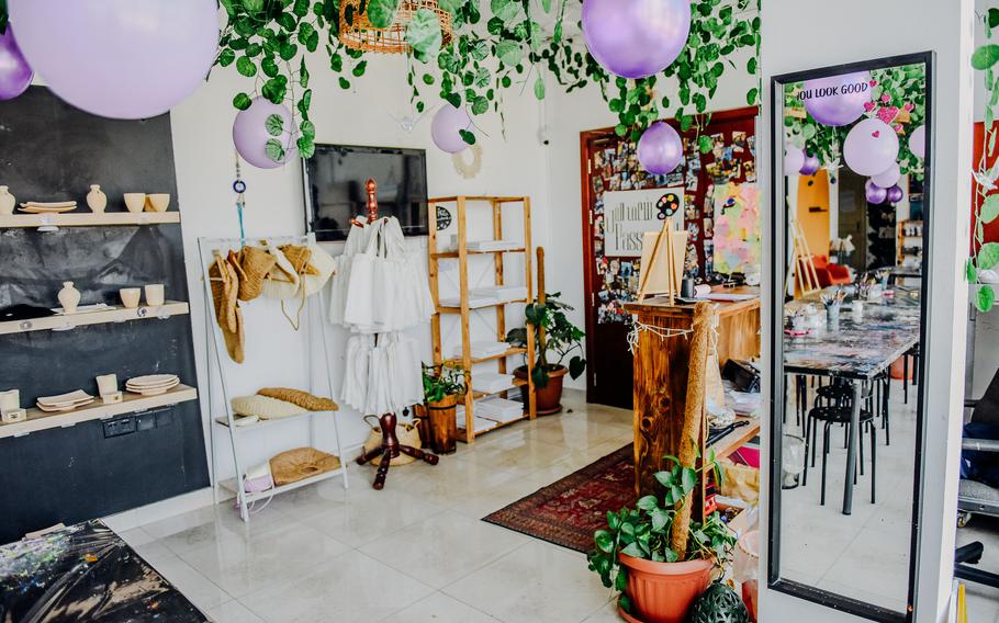 A full-length mirror in the studio at Bahrain's Passion Art Cafe is adorned with an affirming message to people creating art there.