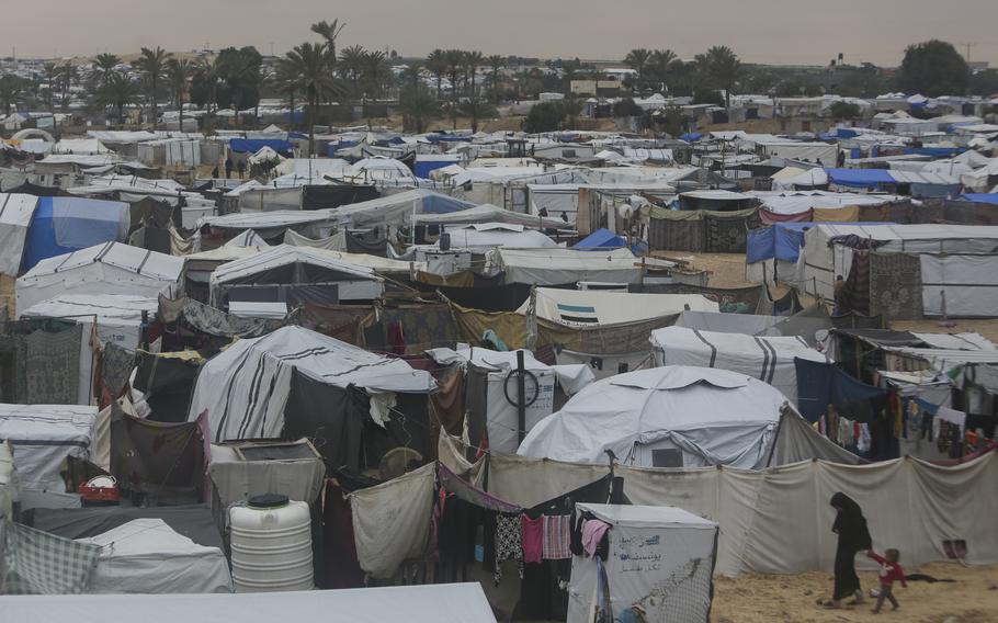 A mass of dozens of tents.