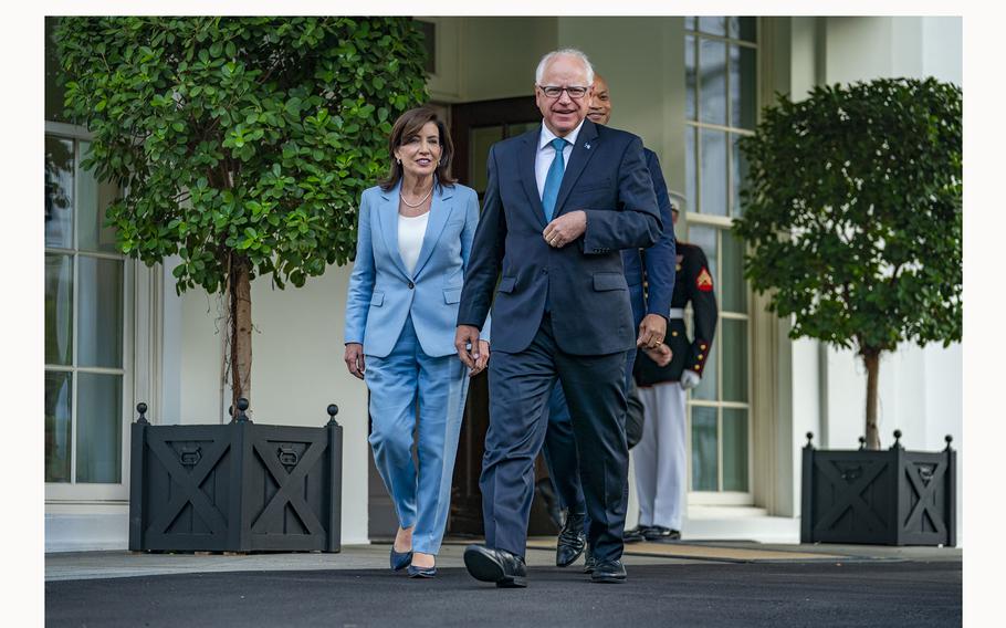 New York Gov. Kathy Hochul, Minnesota Gov. Tim Walz and Maryland Gov. Wes Moore exit the White House on Wednesday following their meeting with President Biden. 