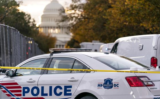 FILE - A Washington Metropolitan Police vehicle is seen near the Capitol, Oct. 19, 2022, in Washington.  Three gun shops that sold nearly three dozen firearms to a man who trafficked the weapons in and around Washington, D.C., are facing a new lawsuit filed Tuesday, jointly by attorneys general for Maryland and the nation’s capital. (AP Photo/J. Scott Applewhite, File)