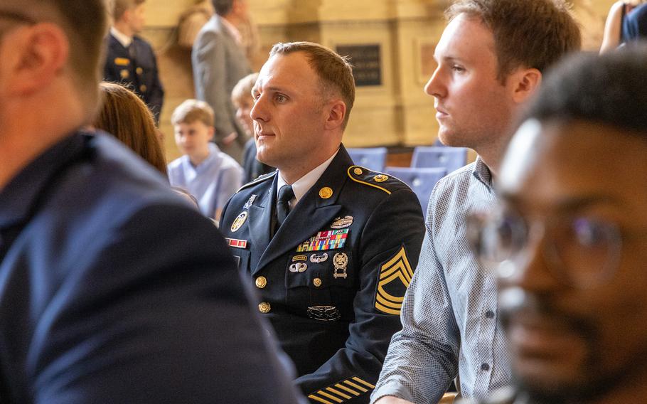 Army Master Sgt. Daniel Brooks, seen here in the background, traveled to Munich, Germany on May 2, 2024, to receive the Christophorus Medal for lifesaving actions from Bavarian governor Markus Söder during at ceremony at the Munich Residence.