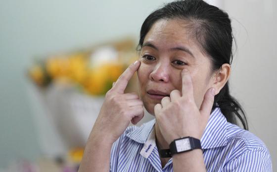 Chhim Sithar, president of the Labor Rights Supported Union of Khmer Employees of NagaWorld, gestures as she meets her supporters in a club at the outskirts of Phnom Penh Cambodia, Monday, Sept. 16, 2024, after the union leader was freed from prison on Monday after serving time for her part in a strike against the country's biggest casino. (AP Photo/Heng Sinith)