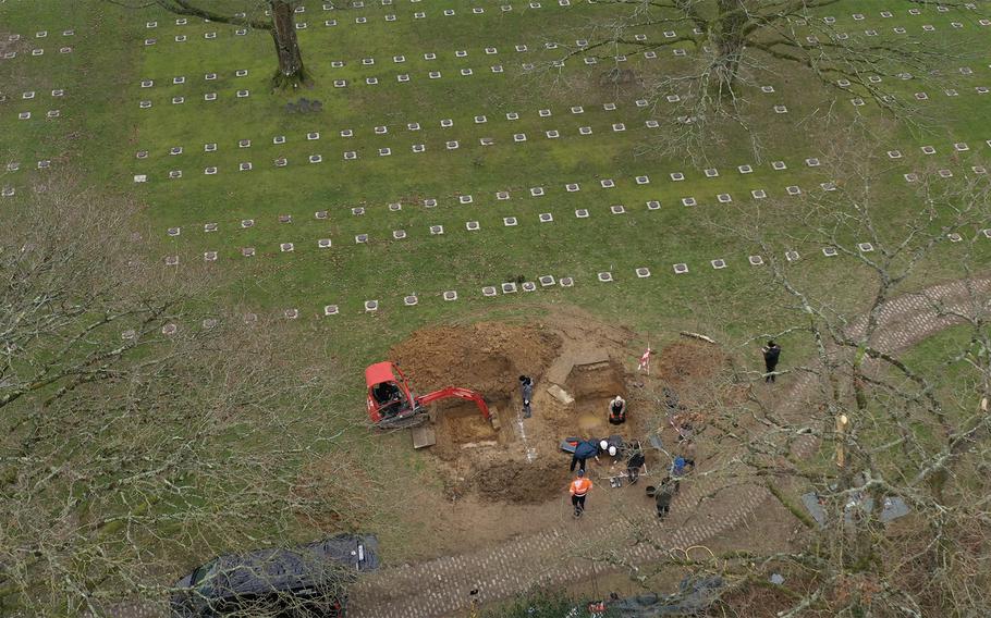 A team of specialists contracted by the PFC Lawrence Gordon Foundation disinters remains from a mass grave at the Marigny German War Cemetery in Thereval, France, in December 2023. The grave contained remains that were later identified as those of U.S. Army 1st Lt. Nathan Baskind.