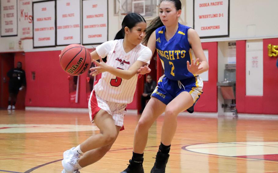 Lindsey Andrew drives toward the basket.